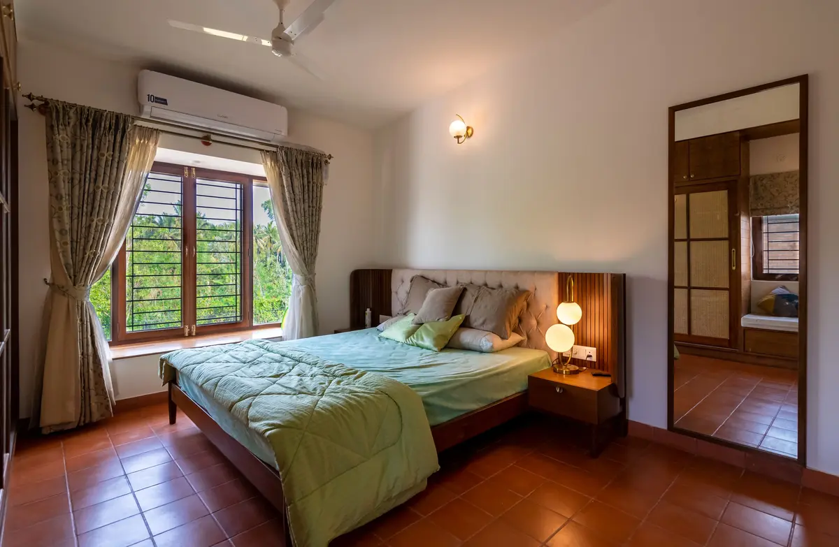 Temple Tree House bedroom with winged cushion headboard